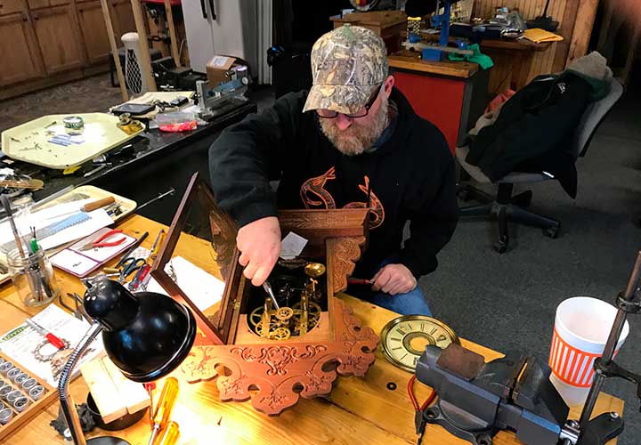 Jimmy repairing antique clock
